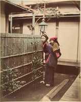 Free download [Japanese Woman in Traditional Dress Posing with a Child on her Back] free photo or picture to be edited with GIMP online image editor